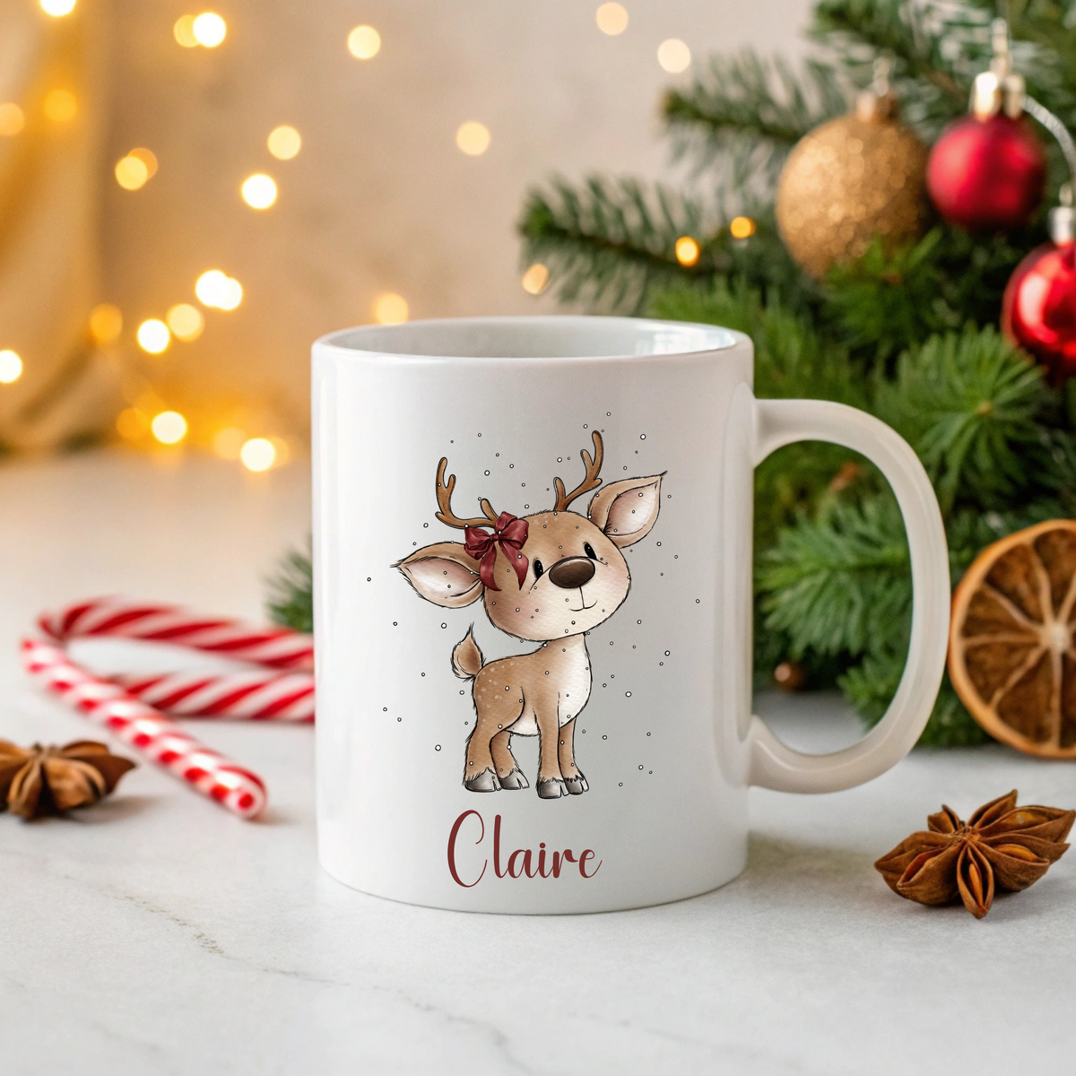 Personalised Christmas ceramic mug featuring a cute reindeer with a bow and personalised with a name, printed in-house by South Shore Gifts.
