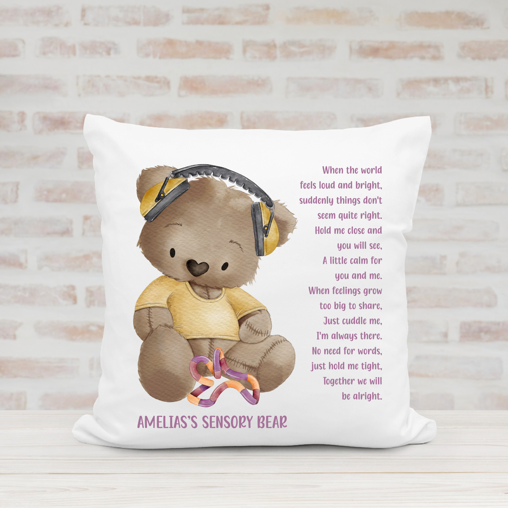 Personalised children's sensory comfort cushion featuring a teddy bear in yellow with ear defenders, sensory toy and reassuring poem.