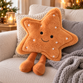 Large Fluffy happy face star cushion with white polka dots, embroidered smile and dangling legs, sitting on a cosy sofa with grey knitted throw.