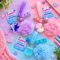 Fluffy Fidget Keychains in pink, purple and blue featuring soft pom-poms, sensory liquid charms, clickers, bells and matching wrist straps.
